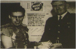 Caption: Blaze Bayley (left of course!) hands over the &pound;50 donation to Superintendent Don Robinson.