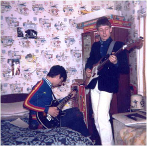 Brian Lacey (left) and Mark Mortimer pretending to jam (!!!) in Mark Mortimer&rsquo;s bedroom at his parents' house in Gillway in March 1982.